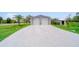 Detached two-car garage with a concrete driveway and well-maintained grassy area at 405 Ridgecrest Dr, Punta Gorda, FL 33982