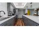 Modern kitchen with stainless steel appliances, grey cabinets and white countertops at 405 Ridgecrest Dr, Punta Gorda, FL 33982