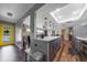 Bright, updated kitchen with center island, pendant lights and a yellow door at 405 Ridgecrest Dr, Punta Gorda, FL 33982