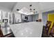 Kitchen with quartz countertops, gray cabinetry, stainless steel refrigerator, and decorative pendant lighting at 405 Ridgecrest Dr, Punta Gorda, FL 33982