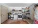 Functional laundry room with washer, dryer, shelving, and water heater at 405 Ridgecrest Dr, Punta Gorda, FL 33982