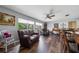 Inviting living room filled with natural light, wood floors, and plush furnishings at 405 Ridgecrest Dr, Punta Gorda, FL 33982