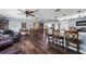 Open concept living and dining area features wood flooring and a ceiling fan at 405 Ridgecrest Dr, Punta Gorda, FL 33982