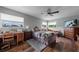 A spacious primary bedroom features a ceiling fan, wood floors, and plenty of natural light at 405 Ridgecrest Dr, Punta Gorda, FL 33982