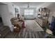 Bright living room with neutral paint, ceiling fan, and comfortable furnishings presents a cozy atmosphere at 4158 Tamiami Trl # U4, Port Charlotte, FL 33952