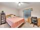Bedroom with a pink comforter, neutral walls, and furniture at 421 Strasburg Dr, Port Charlotte, FL 33954