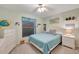 Bedroom with a colorful comforter, neutral walls, and white accents at 421 Strasburg Dr, Port Charlotte, FL 33954