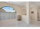 Bright dining room features tiled floors, neutral paint, arched windows, and classic arches at 421 Strasburg Dr, Port Charlotte, FL 33954