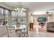Bright dining area open to the living room, with access to a lanai and views of the pool at 421 Strasburg Dr, Port Charlotte, FL 33954