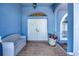 Inviting entryway featuring double doors, brick flooring, and a cozy bench, creating a warm welcome at 421 Strasburg Dr, Port Charlotte, FL 33954