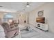Spacious living room boasts tile floors, neutral paint, and modern decor at 421 Strasburg Dr, Port Charlotte, FL 33954