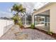 Gravel and stone walkway along the side of the home with a pool view at 4268 Leesburg Ave, North Port, FL 34288