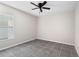 Cozy bedroom with ceiling fan, window and tile flooring throughout at 4268 Leesburg Ave, North Port, FL 34288