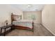 Bedroom featuring a ceiling fan, carpeted floor and a large window at 4268 Leesburg Ave, North Port, FL 34288