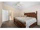 Comfortable bedroom featuring a ceiling fan, carpeted floor and a large window at 4268 Leesburg Ave, North Port, FL 34288