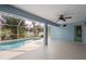Covered lanai with view of pool and tropical foliage at 4268 Leesburg Ave, North Port, FL 34288