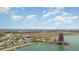 Wide aerial view of the community, showing the pool, recreational areas, and a lake in the distance at 42771 Valley Brooks St, Punta Gorda, FL 33982