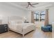 Inviting bedroom features a large window with lake views and tray ceiling at 42771 Valley Brooks St, Punta Gorda, FL 33982