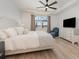Bright bedroom features a large window with lake views and tray ceiling at 42771 Valley Brooks St, Punta Gorda, FL 33982