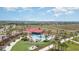 The community pool with red umbrellas and poolside seating creates a relaxing place for residents to enjoy at 42771 Valley Brooks St, Punta Gorda, FL 33982