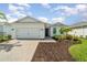 Charming single-story home with a two-car garage, manicured landscaping, and a welcoming entrance at 42771 Valley Brooks St, Punta Gorda, FL 33982