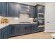 Well-equipped kitchen with stainless steel appliances, stylish cabinets, and ample counter space at 42771 Valley Brooks St, Punta Gorda, FL 33982