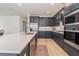 Modern kitchen featuring an island with stainless steel appliances and stylish cabinets at 42771 Valley Brooks St, Punta Gorda, FL 33982
