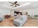 Open-concept living area with hardwood floors, stylish furniture, and plenty of natural light at 42771 Valley Brooks St, Punta Gorda, FL 33982