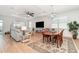 Bright and airy living area with a decorative ceiling, comfortable seating, and elegant decor at 42771 Valley Brooks St, Punta Gorda, FL 33982