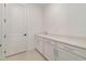 White cabinets and counter space make this mud room practical and beautiful at 42771 Valley Brooks St, Punta Gorda, FL 33982
