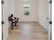 Home office with natural light and hardwood floors at 42771 Valley Brooks St, Punta Gorda, FL 33982