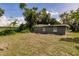 Lush green backyard with ample space and privacy provided by mature trees at 4371 Guard St, Punta Gorda, FL 33980