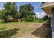 Spacious backyard with lush lawn and a wooden fence line at 4371 Guard St, Punta Gorda, FL 33980