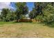 Green backyard featuring a wooden fence that offers privacy at 4371 Guard St, Punta Gorda, FL 33980
