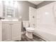 A clean and modern bathroom featuring a shower-tub combo with a white toilet and vanity at 4371 Guard St, Punta Gorda, FL 33980