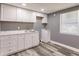 The bedroom features grey walls, wood-look flooring and two windows at 4371 Guard St, Punta Gorda, FL 33980