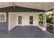 Lovely covered patio with double doors and decorative support pillars at 4371 Guard St, Punta Gorda, FL 33980