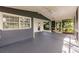 The screened patio has a ceiling fan and painted floor at 4371 Guard St, Punta Gorda, FL 33980