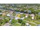 Aerial view of a property with a spacious yard, pool, canal access, and boat parking at 4509 Wynkoop Cir, Port Charlotte, FL 33948