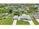 Expansive aerial view of a single-Gathering home with a spacious yard and a detached two-car garage at 4509 Wynkoop Cir, Port Charlotte, FL 33948