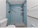 Bathroom shower featuring blue tile and installed safety bars at 4509 Wynkoop Cir, Port Charlotte, FL 33948
