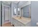 Bathroom vanity with updated sink and storage along with a large mirror at 4509 Wynkoop Cir, Port Charlotte, FL 33948