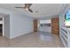 Bonus room features tile floor, custom built-ins, and a ceiling fan at 4509 Wynkoop Cir, Port Charlotte, FL 33948