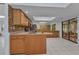 Open kitchen area with modern appliances, tile floors, a sink, and bar seating at 4509 Wynkoop Cir, Port Charlotte, FL 33948