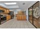 Bright eat-in kitchen features skylight, stainless steel appliances, and ample counter space at 4509 Wynkoop Cir, Port Charlotte, FL 33948