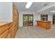 Bright kitchen boasts extensive cabinetry, tile floors, and a seamless flow to outdoor access at 4509 Wynkoop Cir, Port Charlotte, FL 33948