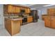 Functional kitchen featuring stainless steel appliances, tile backsplash, and ample storage at 4509 Wynkoop Cir, Port Charlotte, FL 33948