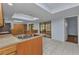 Spacious kitchen with stainless steel sink, skylight and custom wood cabinets at 4509 Wynkoop Cir, Port Charlotte, FL 33948