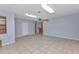 Spacious living area with tile floors, large windows, and ample natural light at 4509 Wynkoop Cir, Port Charlotte, FL 33948
