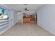 Open living room with tile flooring, view into kitchen and bonus room at 4509 Wynkoop Cir, Port Charlotte, FL 33948